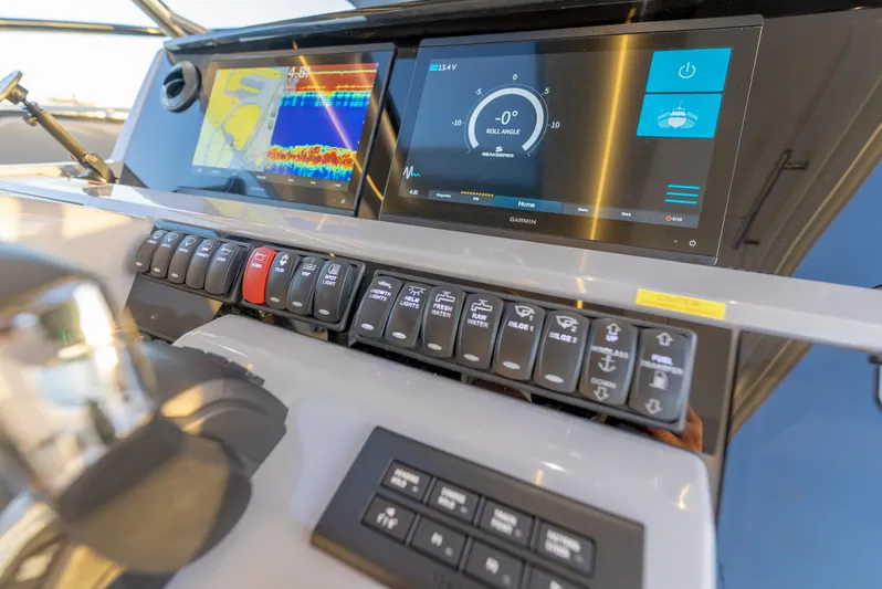  Yacht Photos Pics Control panel of 2022 Jeanneau Leader 12.5 WA boat with advanced navigation displays.