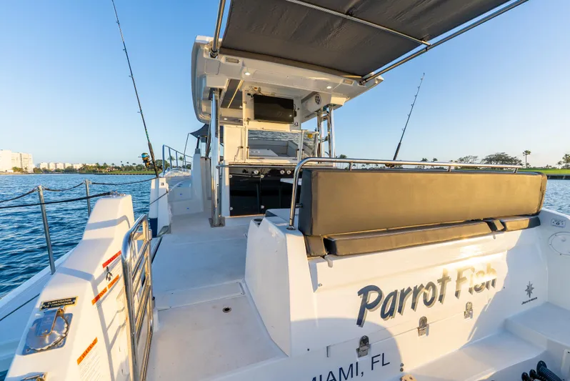  Yacht Photos Pics 2022 Jeanneau Leader 12.5 WA boat with spacious deck and seating, cruising in Miami waters.