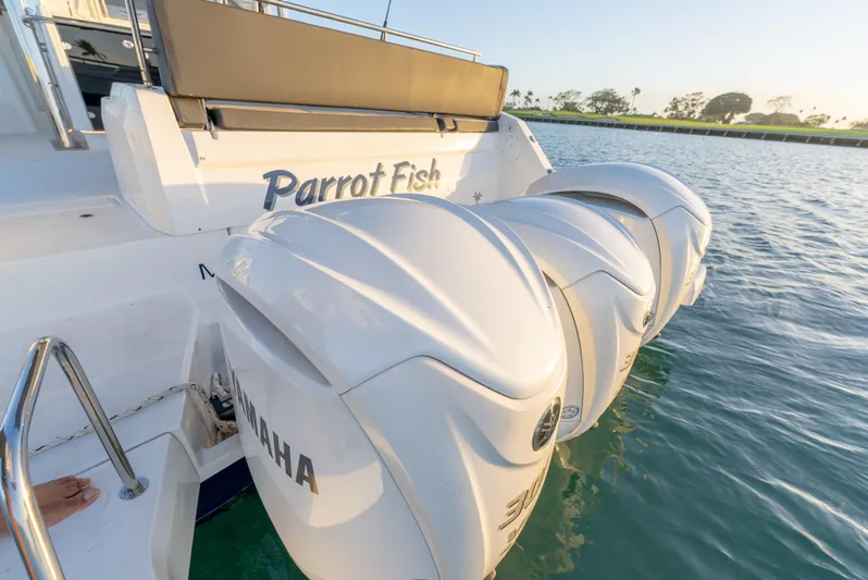  Yacht Photos Pics 2022 Jeanneau Leader 12.5 WA boat with Yamaha engines, named "Parrot Fish," docked on water.