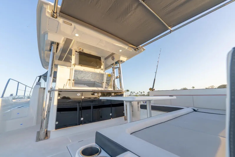  Yacht Photos Pics 2022 Jeanneau Leader 12.5 WA boat deck with seating and canopy.