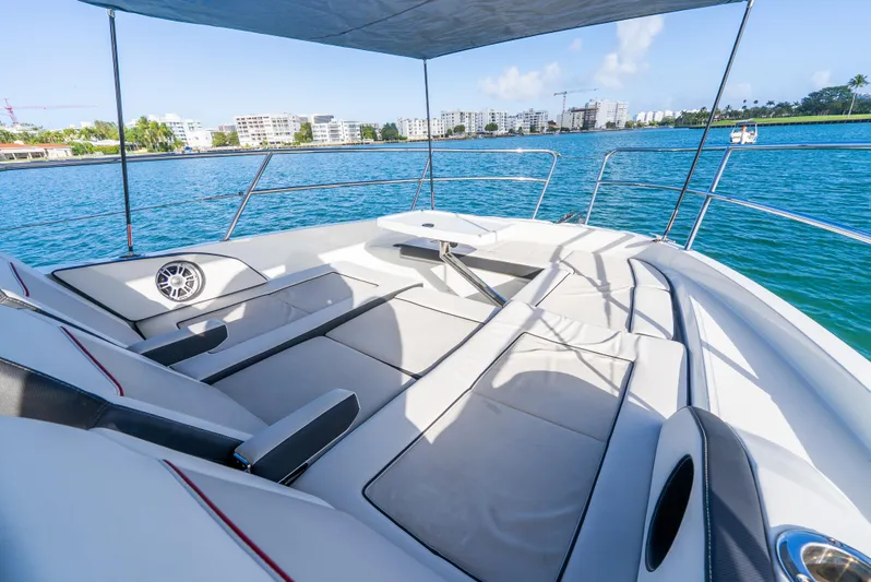  Yacht Photos Pics Luxurious Jeanneau Leader 12.5 WA 2022 boat with spacious deck and scenic waterfront view.