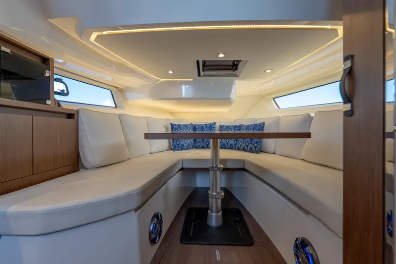  Yacht Photos Pics Interior of 2022 Jeanneau Leader 12.5 WA boat with elegant seating and modern design.