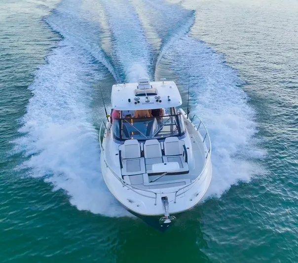  Yacht Photos Pics 2022 Jeanneau Leader 12.5 WA cruising on open water, aerial view.