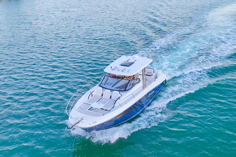  Yacht Photos Pics 2022 Jeanneau Leader 12.5 WA cruising on clear blue water.