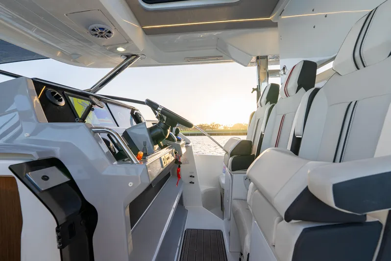  Yacht Photos Pics Interior of 2022 Jeanneau Leader 12.5 WA boat with modern seating and helm.