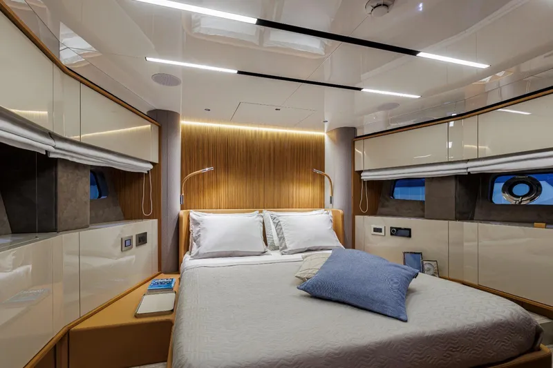  Yacht Photos Pics Luxurious bedroom interior of 2025 Cranchi Sessantadue 62 yacht with modern design elements.