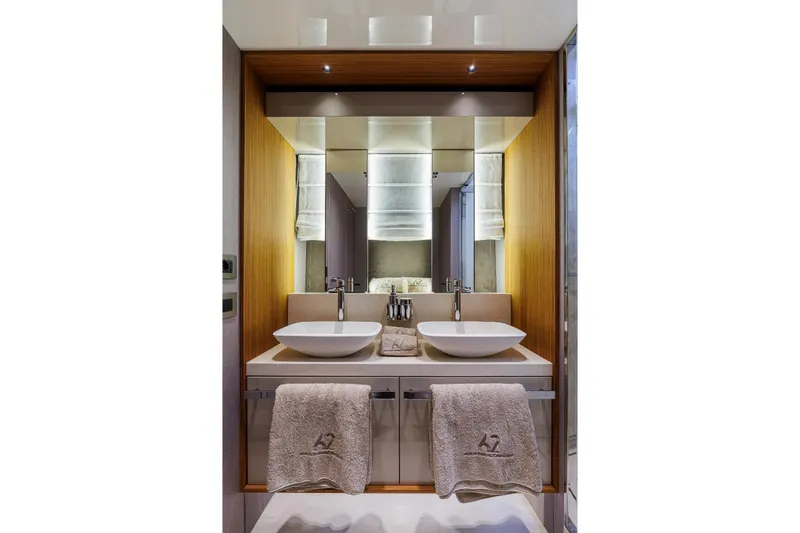 Yacht Photos Pics Luxurious bathroom in 2025 Cranchi Sessantadue 62 yacht with dual sinks and elegant design.