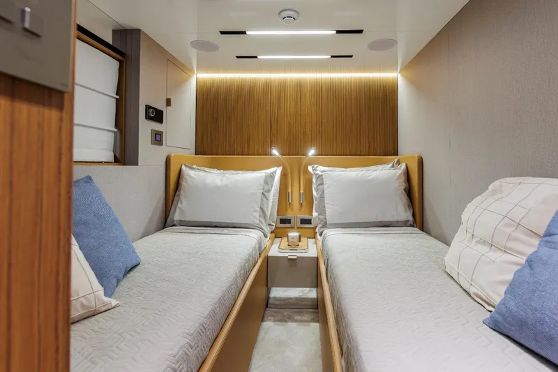  Yacht Photos Pics Luxurious twin cabin interior of 2025 Cranchi Sessantadue 62 yacht, featuring modern design.