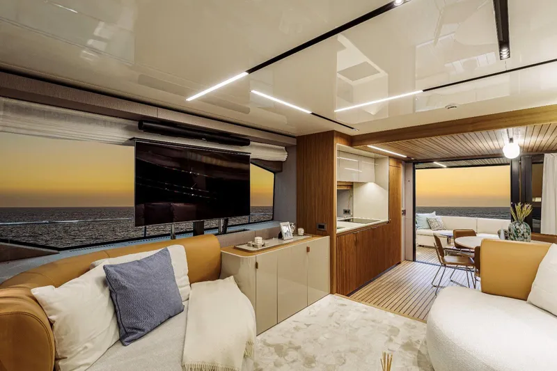  Yacht Photos Pics Luxurious interior of 2025 Cranchi Sessantadue 62 yacht with ocean view at sunset.