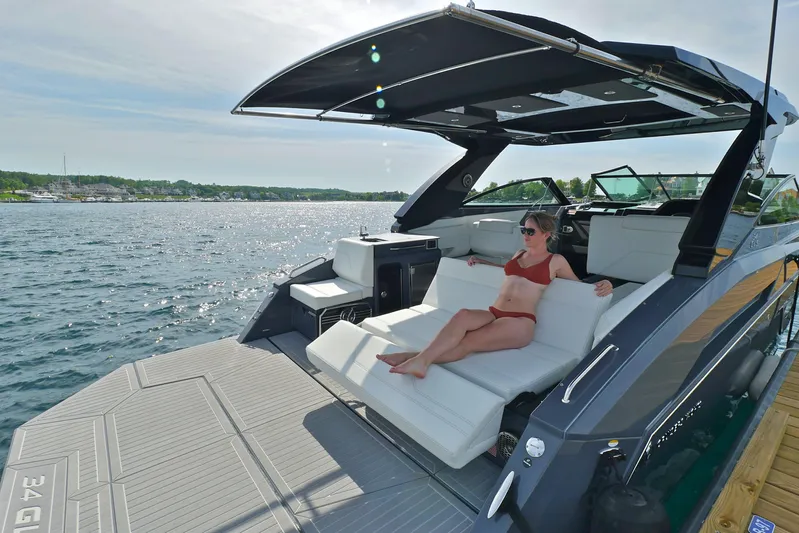  Yacht Photos Pics 2026 Cruisers Yachts 34 GLS I/O with sunbathing area on open water.