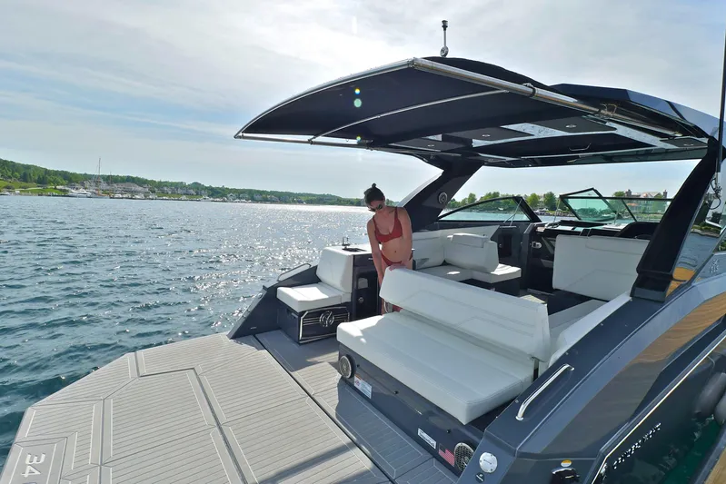  Yacht Photos Pics 2026 Cruisers Yachts 34 GLS I/O on water, featuring spacious deck and seating area.