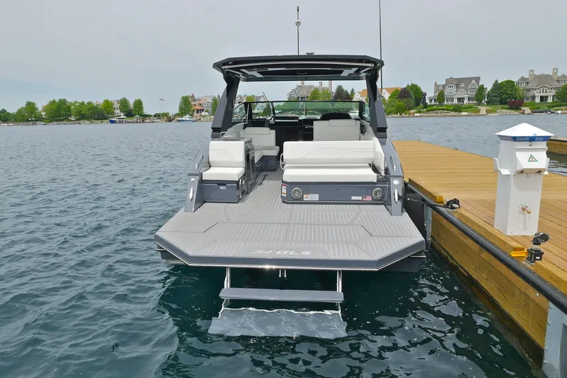  Yacht Photos Pics 2026 Cruisers Yachts 34 GLS I/O docked, showcasing sleek design and spacious seating.