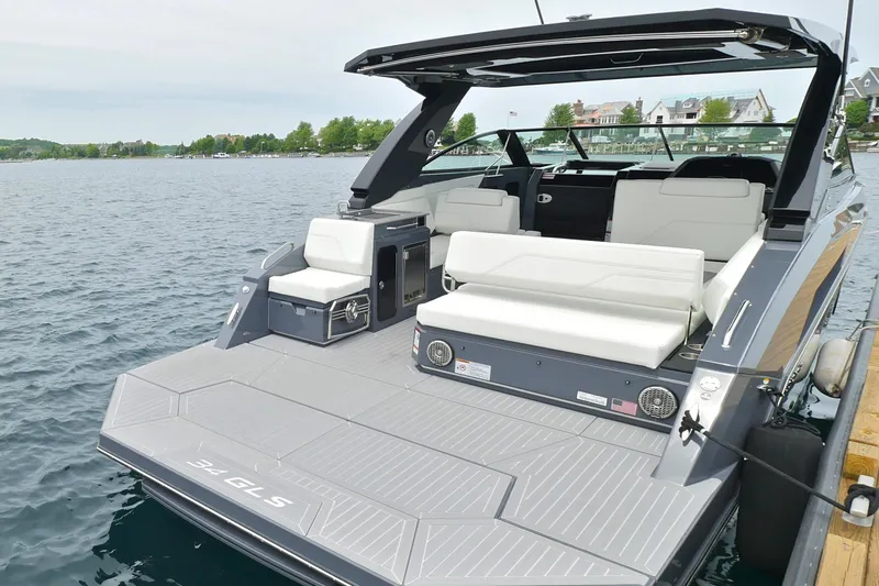  Yacht Photos Pics 2026 Cruisers Yachts 34 GLS I/O luxury boat with spacious deck and seating on water.