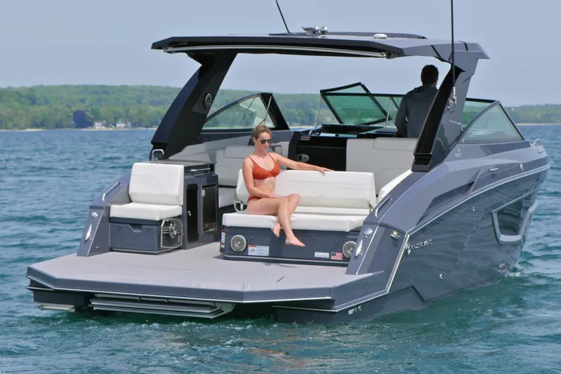  Yacht Photos Pics 2026 Cruisers Yachts 34 GLS I/O on water, featuring sleek design and luxury seating.