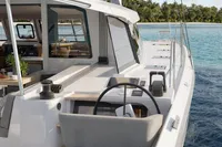 2025 Nautitech 44 Open yacht, sleek design, cruising near tropical island.