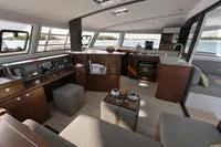 Luxurious interior of 2026 Nautitech 44 Open catamaran with modern kitchen and seating area.