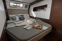 Luxurious cabin interior of 2026 Nautitech 44 Open yacht with cozy bed and modern decor.