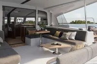 Luxurious interior of 2025 Nautitech 44 Open catamaran with modern seating and ocean view.