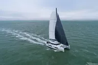 Sailing catamaran Nautitech 44 Open 2026 gliding on open sea under cloudy sky.