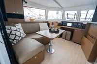 2026 Nautitech 44 Open interior with modern seating, table, and navigation equipment.