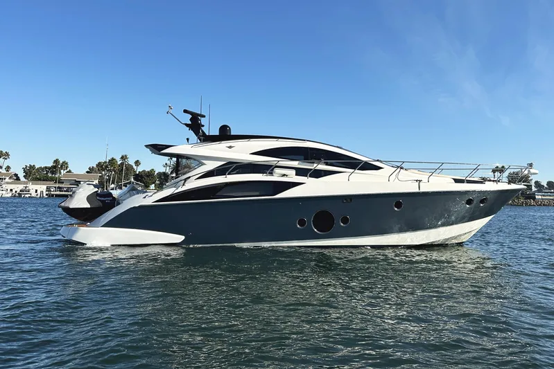 Why Knot Yacht Photos Pics 2011 Marquis Sport Coupe yacht cruising on a sunny day.