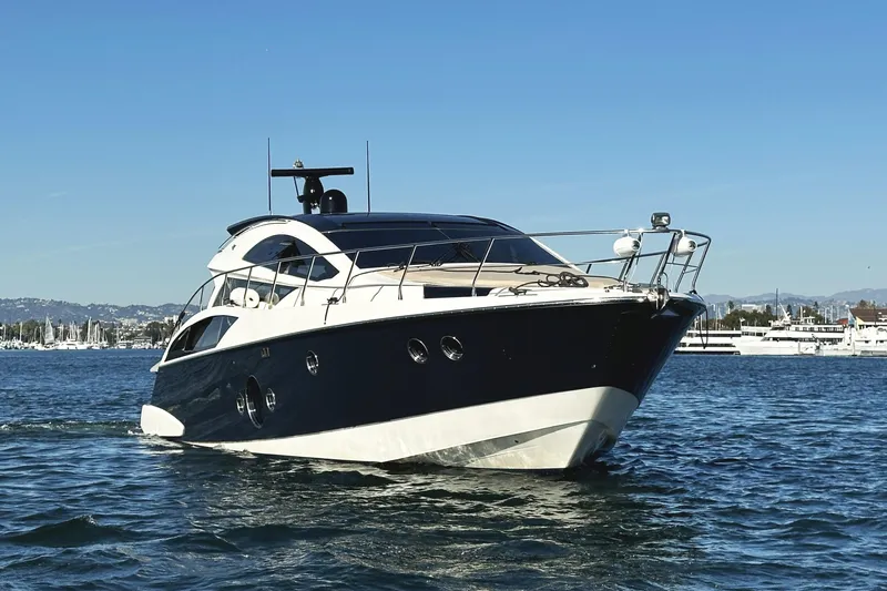 Why Knot Yacht Photos Pics Luxury 2011 Marquis Sport Coupe yacht cruising on a sunny day.