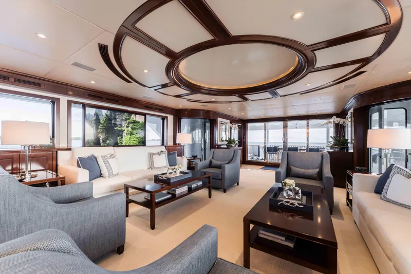 Summerdance Yacht Photos Pics Luxurious interior of 2004 Trinity Yachts motor yacht with elegant seating and panoramic windows.