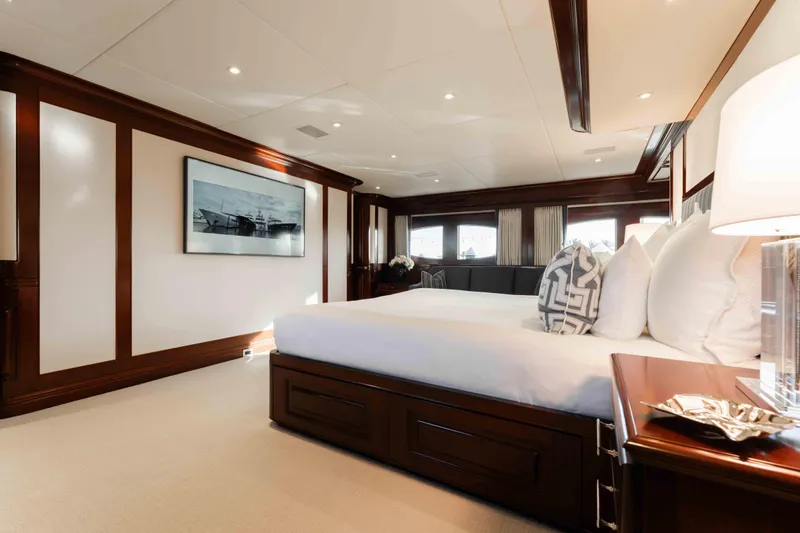 Summerdance Yacht Photos Pics Luxurious bedroom interior of 2004 Trinity Yachts motor yacht with elegant wood paneling.
