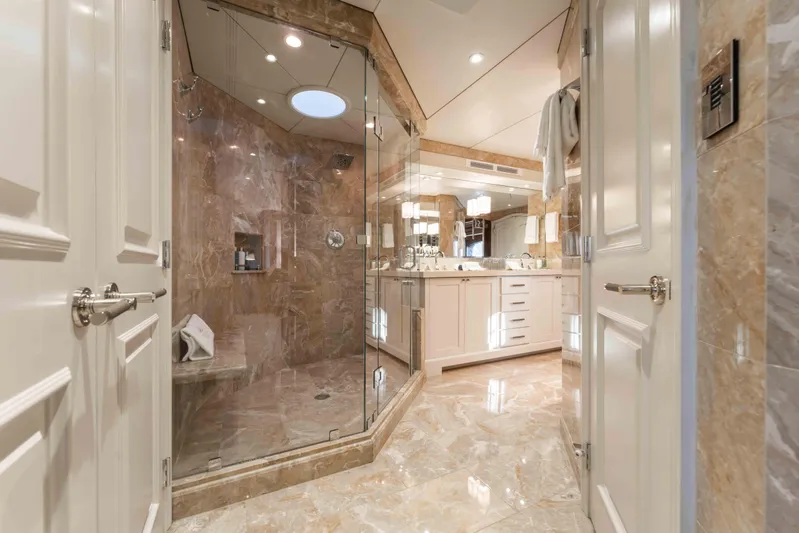 Summerdance Yacht Photos Pics Luxurious marble bathroom on 2004 Trinity Yachts motor yacht, featuring glass shower and elegant fixtures.