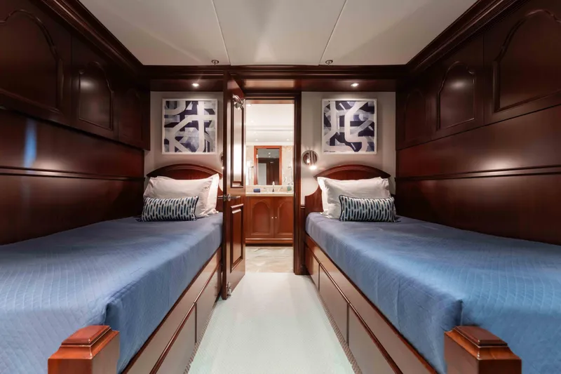 Summerdance Yacht Photos Pics Luxurious twin cabin with wooden paneling on 2004 Trinity Yachts motor yacht.