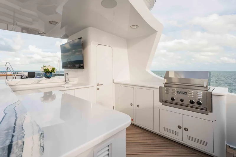Summerdance Yacht Photos Pics Luxurious outdoor kitchen on 2004 Trinity Yachts motor yacht with ocean view.