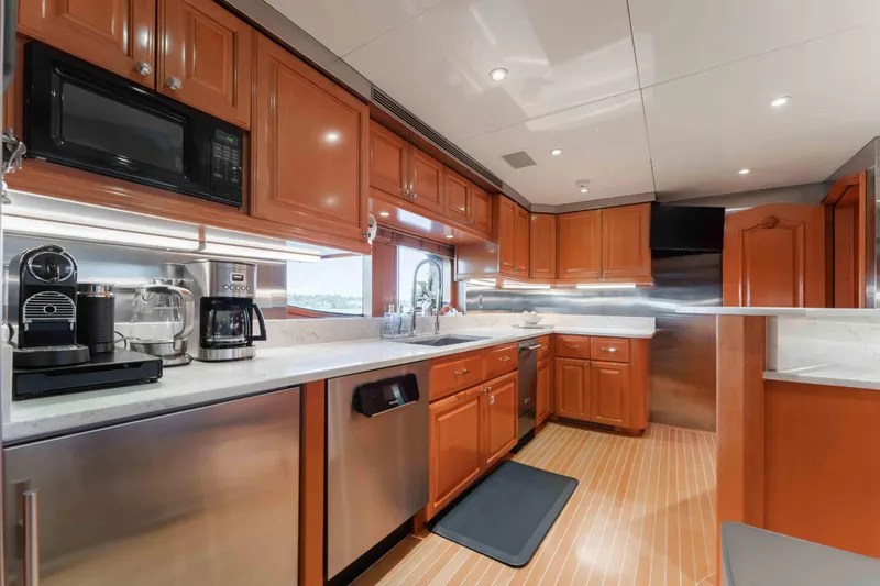 Summerdance Yacht Photos Pics Luxurious kitchen interior of 2004 Trinity Yachts motor yacht with modern appliances.