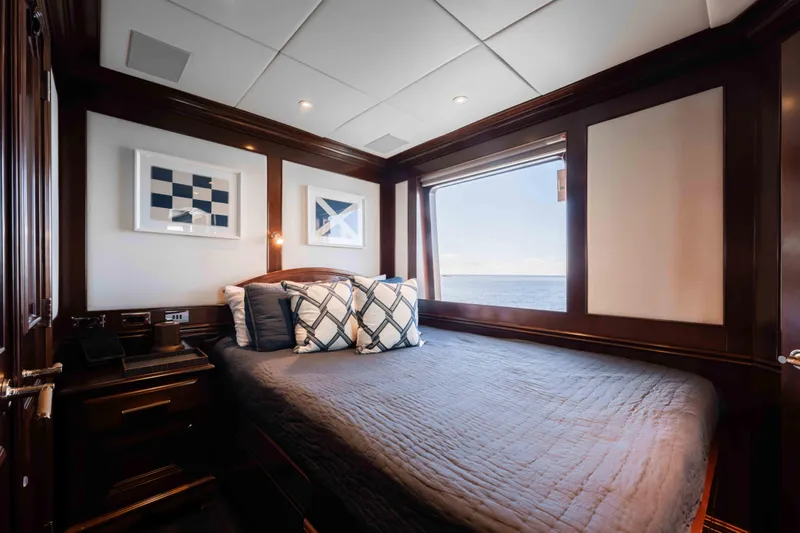 Summerdance Yacht Photos Pics Luxurious 2004 Trinity Yachts motor yacht bedroom with ocean view and elegant decor.