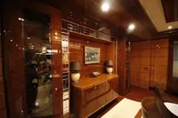 Luxurious interior of 2014 Bilgin Custom 150 yacht with elegant wood paneling and decor.