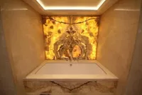 Luxurious marble bathtub with illuminated stone wall, Bilgin Custom 150, 2014.