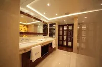 Luxurious bathroom interior on Bilgin Custom 150 yacht, featuring elegant lighting and dual sinks.
