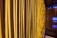 Vertical yellow and brown striped pattern on Bilgin Custom 150 yacht interior, 2014.