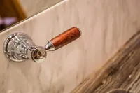 Chrome and wood handle on marble surface, Bilgin Custom 150, 2014.