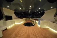 Luxurious interior of 2014 Bilgin Custom 150 yacht with elegant lighting and wooden flooring.