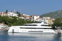 Luxurious 2014 Bilgin Custom 150 yacht docked near scenic coastal town.