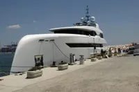 Luxurious 2014 Bilgin Custom 150 yacht docked at a sunny marina.