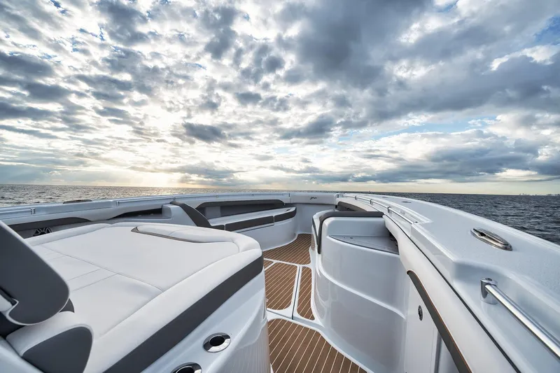  Yacht Photos Pics 2022 Yellowfin 54 Offshore boat deck with ocean view and dramatic cloudy sky.