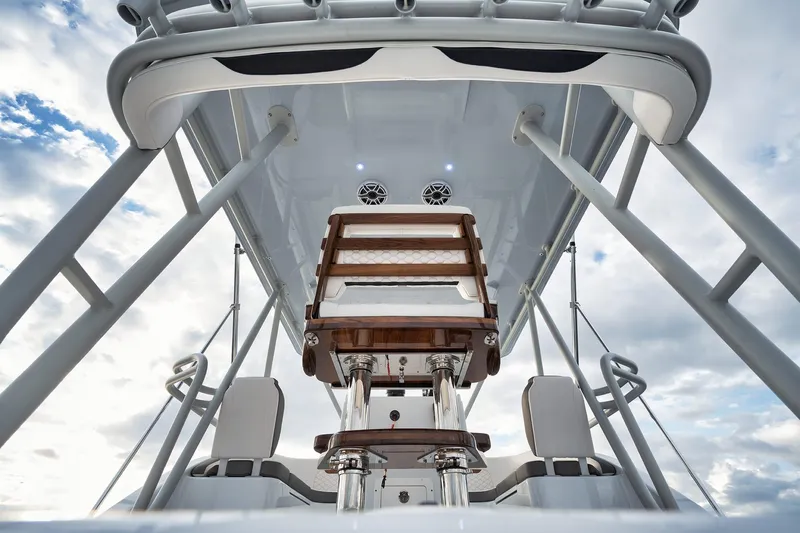  Yacht Photos Pics 2022 Yellowfin 54 Offshore boat interior with seating and overhead view.