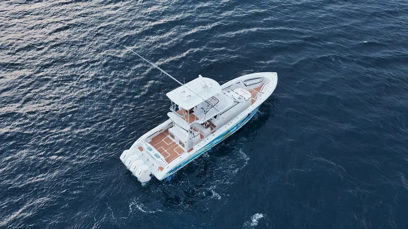  Yacht Photos Pics 2022 Yellowfin 54 Offshore boat cruising on open ocean waters.