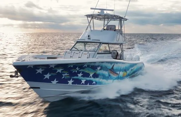  Yacht Photos Pics 2022 Yellowfin 54 Offshore boat cruising on open water with vibrant marine graphics.