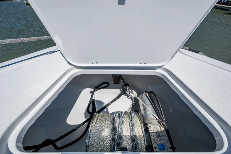  Yacht Photos Pics Open anchor storage on 2022 Yellowfin 54 Offshore boat, showing ropes and chains.