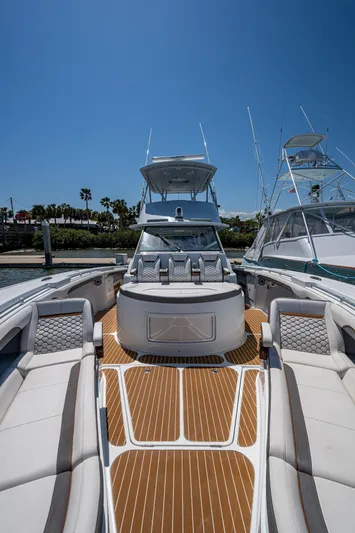  Yacht Photos Pics 2022 Yellowfin 54 Offshore boat with spacious deck and luxurious seating.
