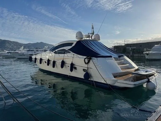  Yacht Photos Pics Luxury 2006 Cantieri di Sarnico 60 yacht docked in a serene marina setting.