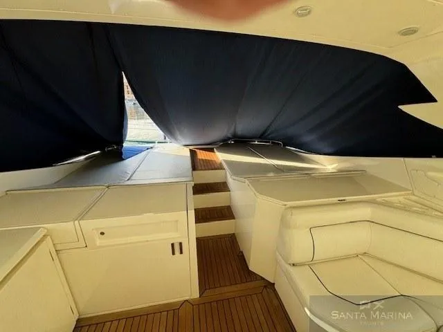  Yacht Photos Pics Interior view of 2006 Cantieri di Sarnico 60 yacht with white seating and wooden flooring.