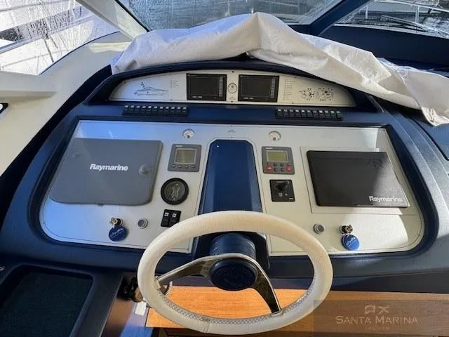  Yacht Photos Pics Helm of 2006 Cantieri di Sarnico 60 yacht with Raymarine navigation equipment.